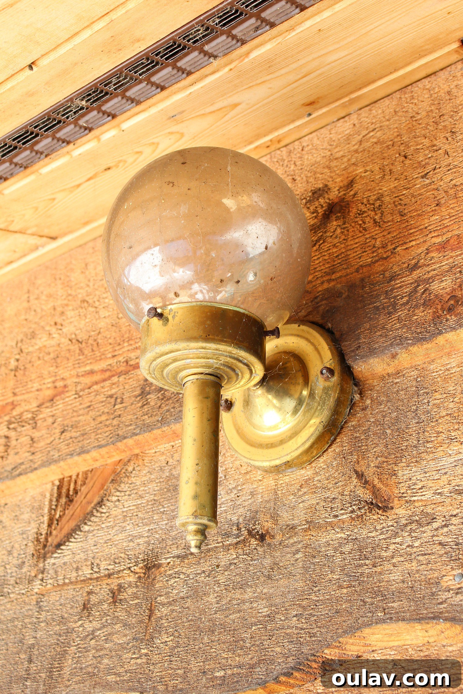 Before and After: Replacing an old brass light fixture with a modern black design