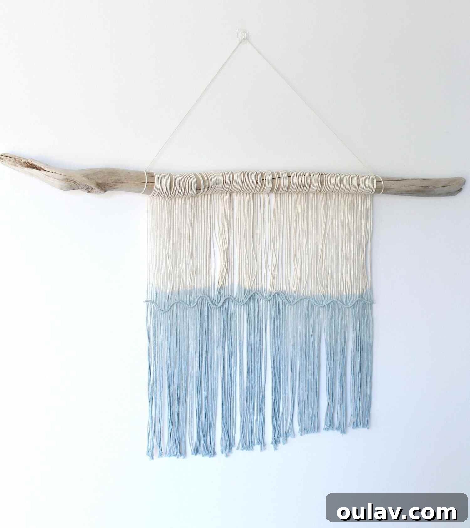 Two close-up images showing different parts of a finished macrame and driftwood wall hanging, highlighting the knots and texture.