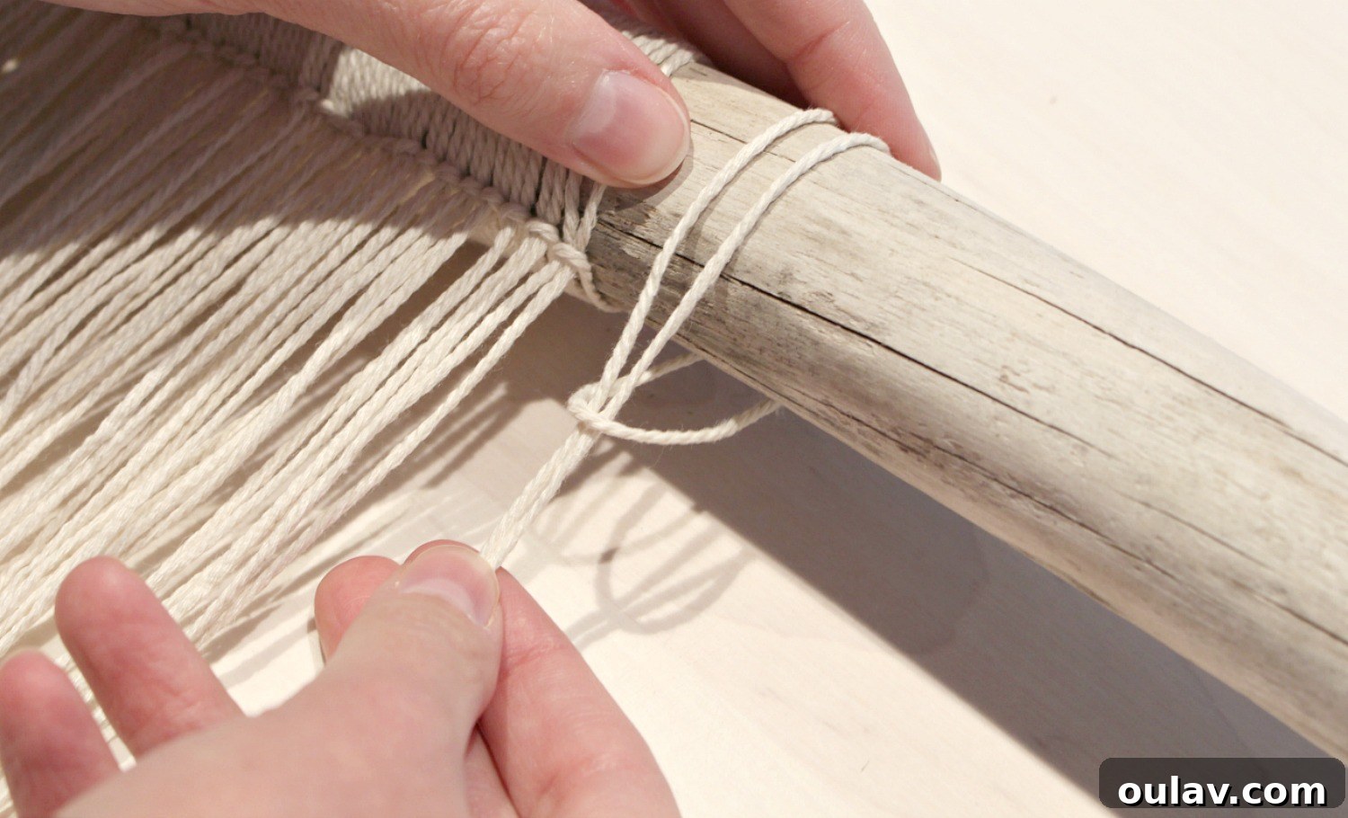 Handcraft Your Own Macrame Driftwood Wall Art 13 A clearer image demonstrating the technique of threading the string ends through the loop to secure it.