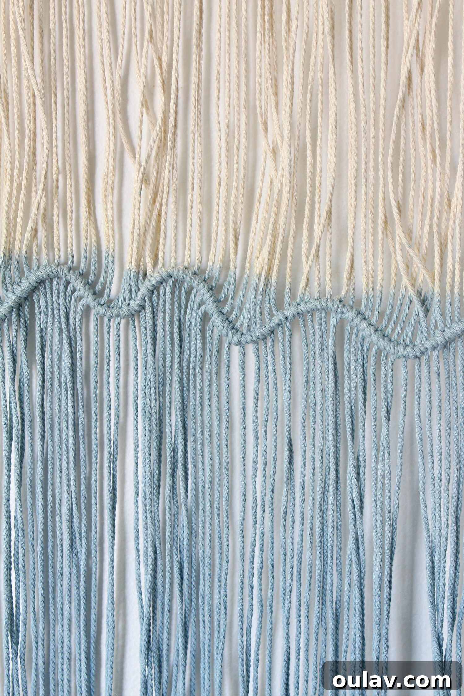Handcraft Your Own Macrame Driftwood Wall Art 27 A closer view of the strings being dip-dyed, showing the color absorption.