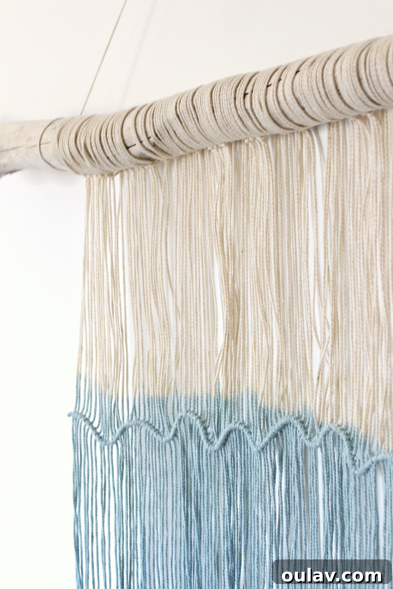 Three different views of the smaller macrame and driftwood wall hanging, showing the details of the knots, texture, and dip-dyed ends.