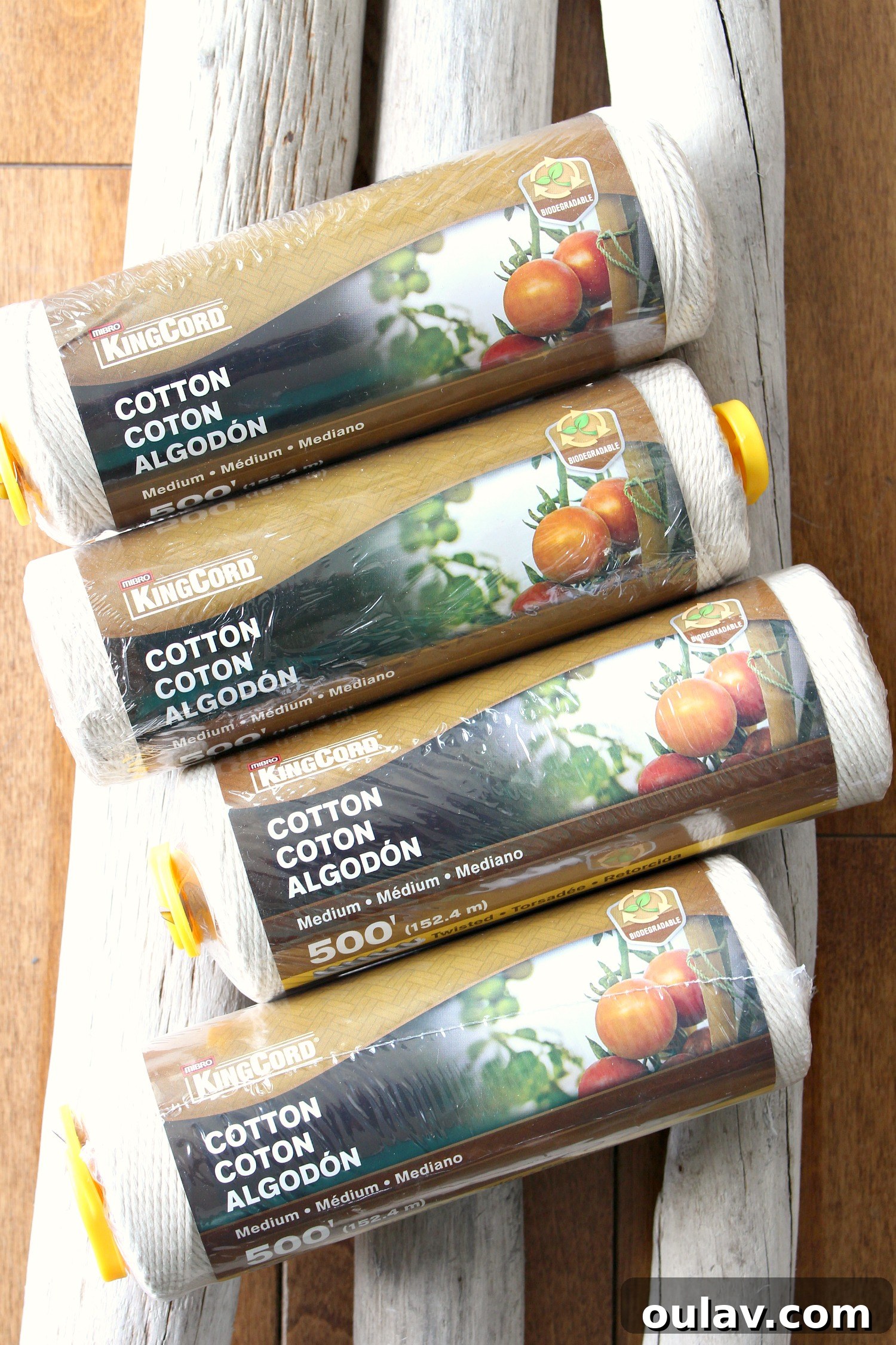 Handcraft Your Own Macrame Driftwood Wall Art 10 A collection of the supplies needed: cotton cord, a piece of driftwood, and various dyes.